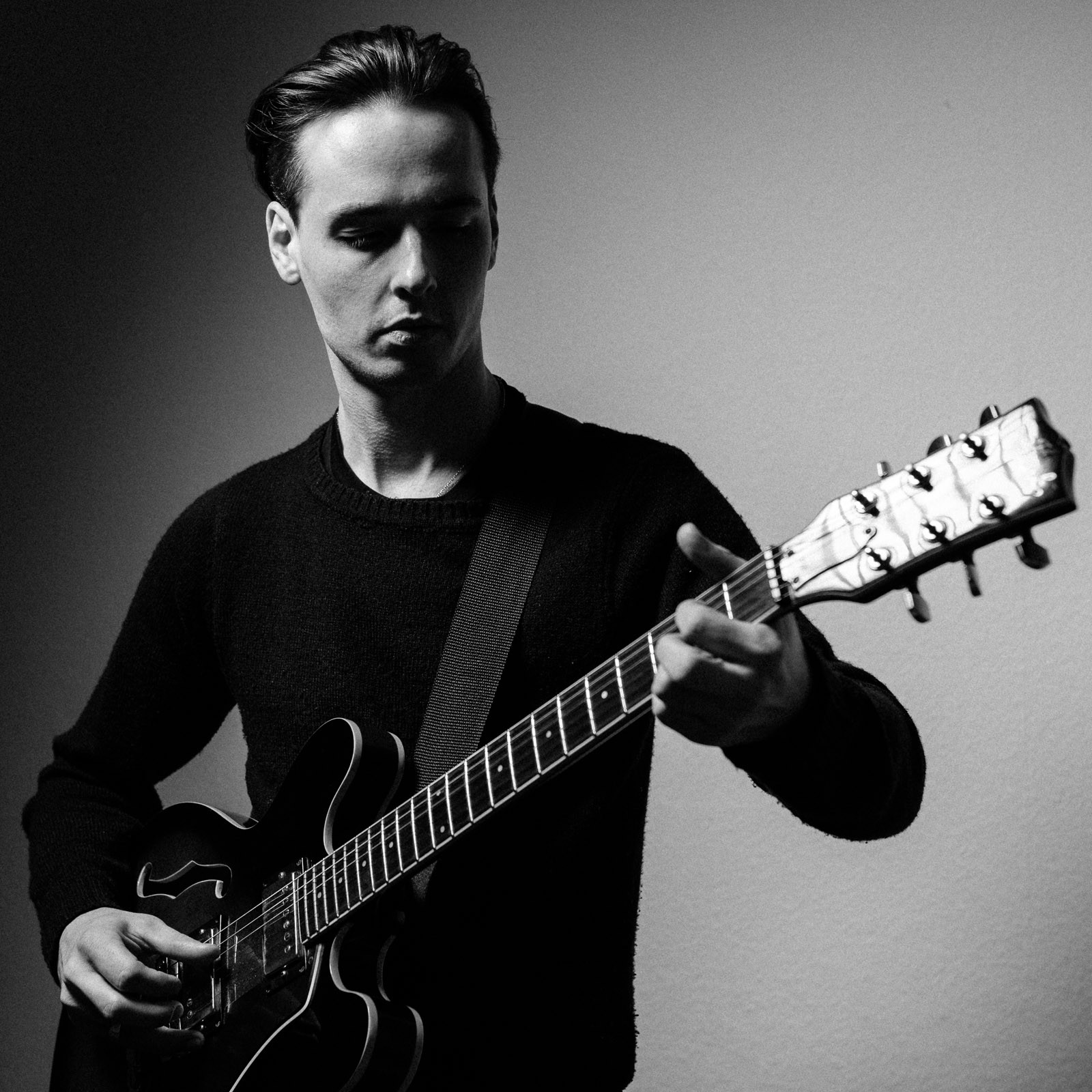 guitar musician black and white portrait shadow
