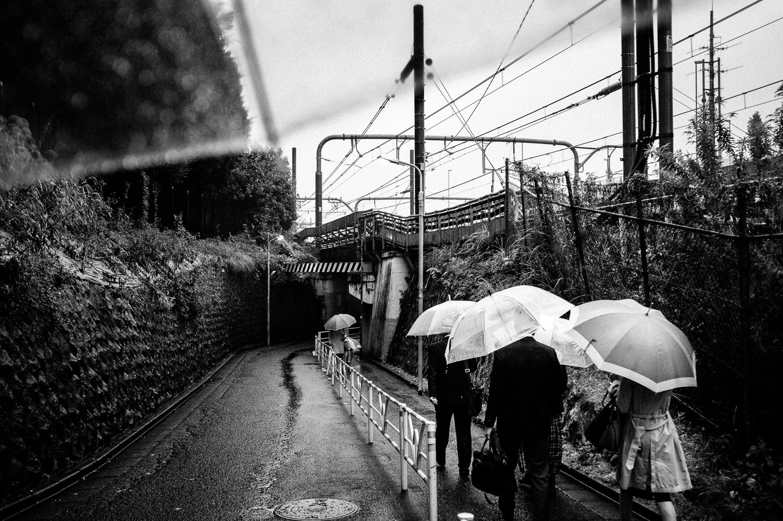 rainy walk in tokyo with umbrella blak and white